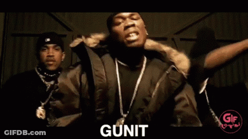 Two Men Sit In Front Of A Range Rover And The Word Gunit Is On The Bottom GIF