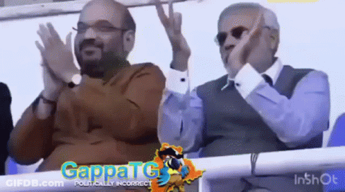 Two Men Sitting And Clapping In Stadium GIF