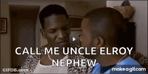 Two Men Sitting And Talking In Living Room GIF