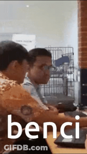 Two Men Sitting At A Table Saying Bench GIF