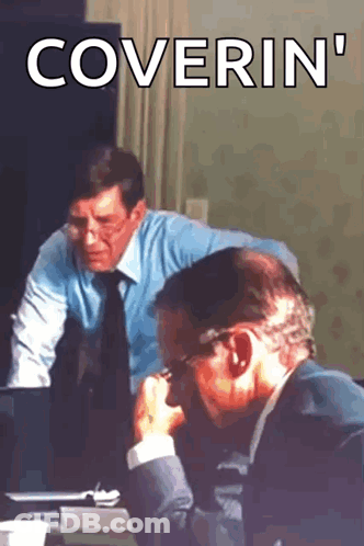 Two Men Sitting At A Table With The Words Coverin ' Written On The Bottom GIF