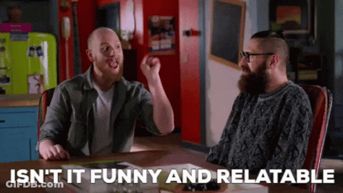 Two Men Sitting At Table With Isn't It Funny And Relatable GIF