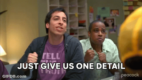 Two Men Sitting At A Table With The Words Just Give Us One Detail GIF
