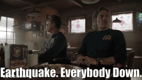 Two Men Sitting At Bar With Earthquake Everybody Down GIF