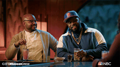 Two Men Sitting At Bar With NBC GIF