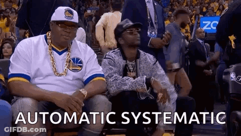 Two Men Sitting At Basketball Game One In Warriors Jersey GIF