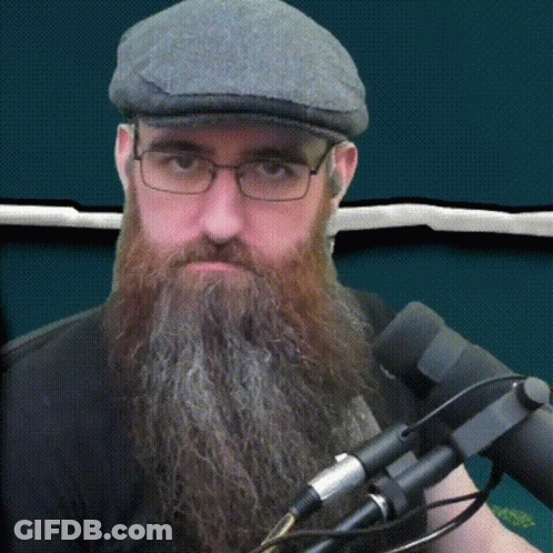 Two Men Sitting At Desk In Front Of Screen Rns Resumen De Noticias Semanal GIF