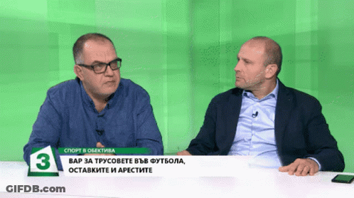 Two Men Sitting At Green Table Number 3 GIF