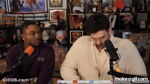 Two Men Sitting At Microphone GIF