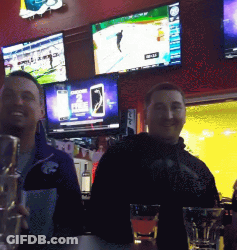 Two Men Sitting At Screen Saying Choose 2 Free GIF