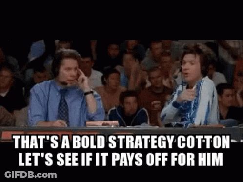 Two Men Sitting At Table In Front Of Crowd GIF