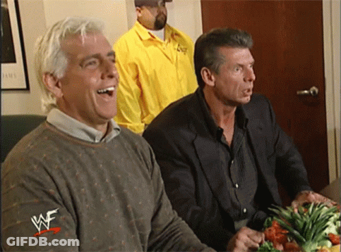 Two Men Sitting At Table GIF