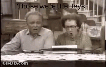 Two Men Sitting At Table Saying Those Were The Days GIF
