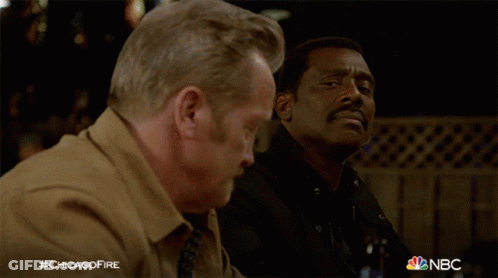 Two Men Sitting At Table With Beer #Chicagofire GIF