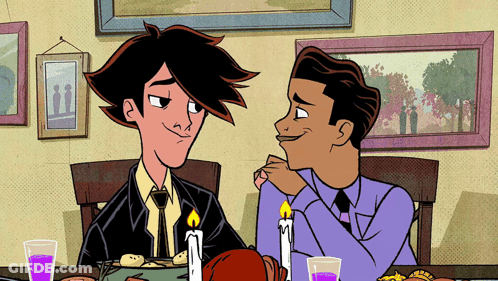 Two Men Sitting At Table With Candles GIF