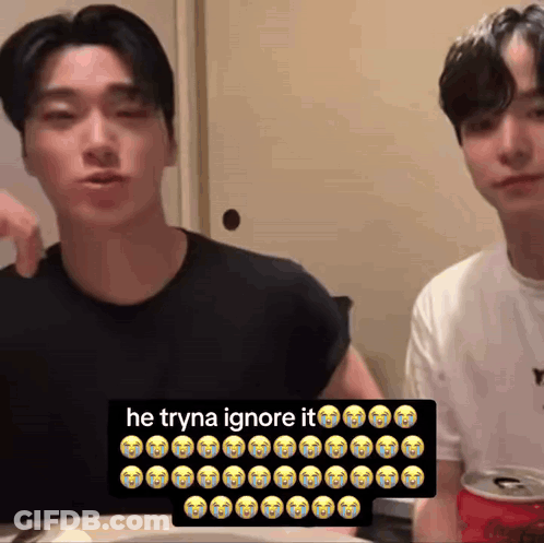 Two Men Sitting At Table With Soda Sign Saying He Tryna Ignore It GIF