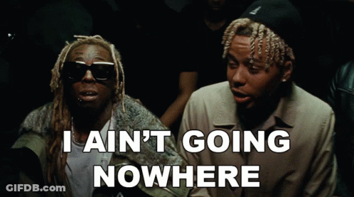 Two Men Sitting I Ain't Going Nowhere GIF