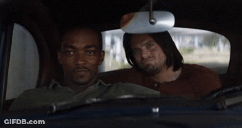 Two Men Sitting In Back Seat Looking Out Window GIF
