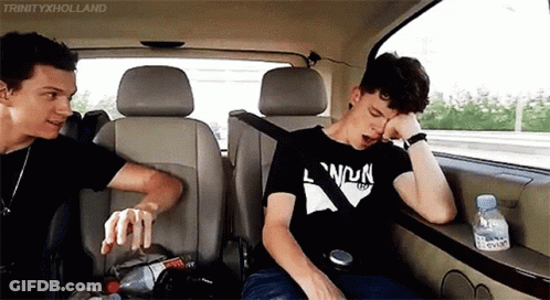 Two Men Sitting In Back Seat Of Car GIF