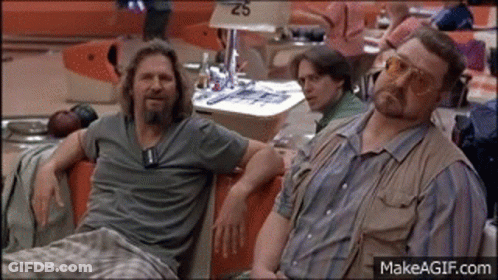 Two Men Sitting In Bowling Alley GIF