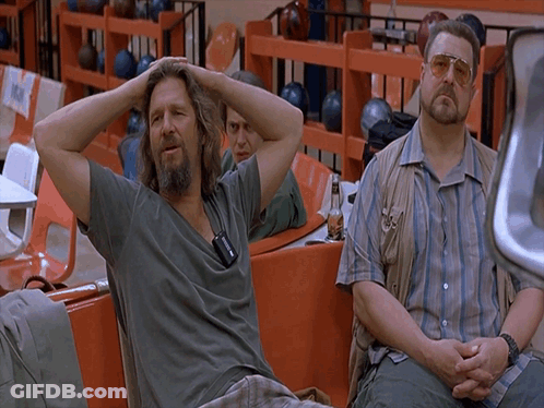 Two Men Sitting In Bowling Alley GIF