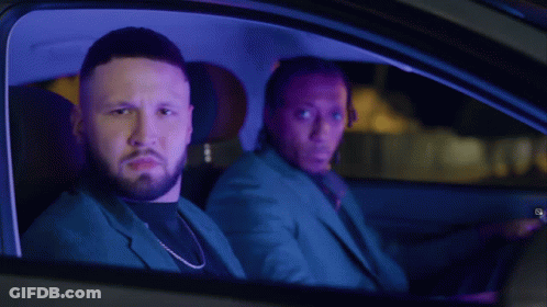 Two Men Sitting In Car At Night With Dreadlocks GIF