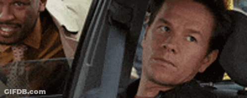 Two Men Sitting In Car Looking Out Window GIF