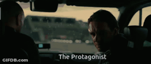 Two Men Sitting In Car With Word Protagonist GIF