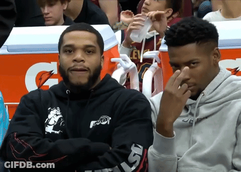 Two Men Sitting In Front Of An Orange Gatorade Box GIF