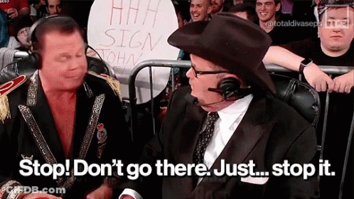Two Men Sitting In Front Of Crowd With Stop Sign GIF