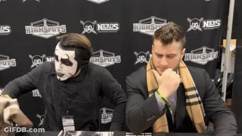 Two Men Sitting In Front Of Highspots Sign GIF