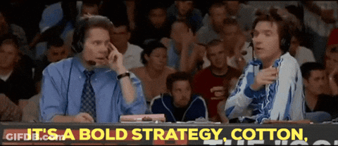Two Men Sitting In Front Of It's A Bold Strategy Sign GIF