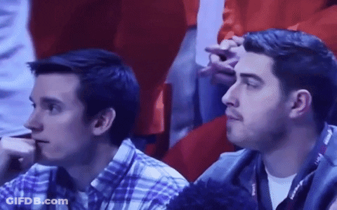 Two Men Sitting In Stadium Watching Game GIF
