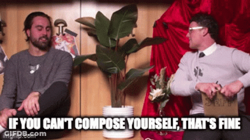 Two Men Sitting Near Potted Plant GIF