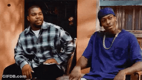 Two Men Sitting Next To Each Other GIF