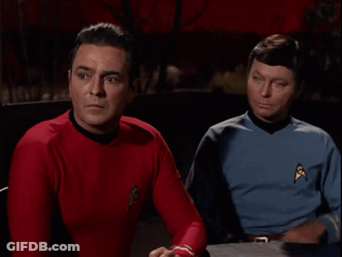 Two Men Sitting Next To Each Other GIF