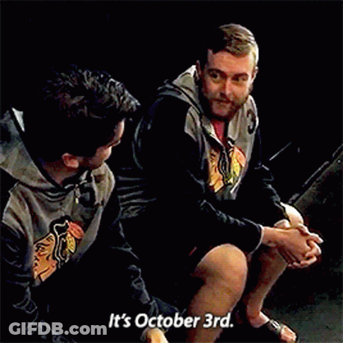 Two Men Sitting Next To Each Other Saying It's October 3Rd GIF