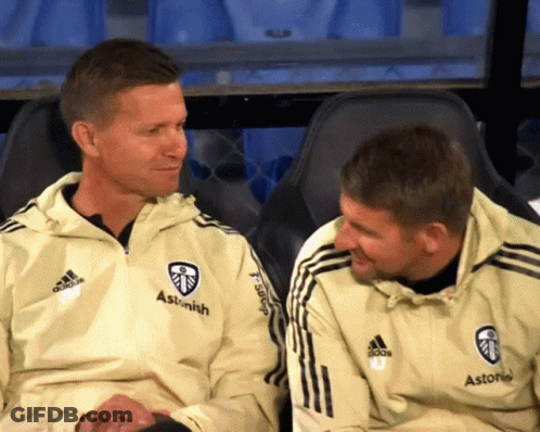 Two Men Sitting Next To Each Other Wearing Jackets That Say Astonish GIF