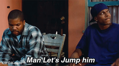 Two Men Sitting Next To Each Other With The Words Man Let 'S Jump Him Above Them GIF