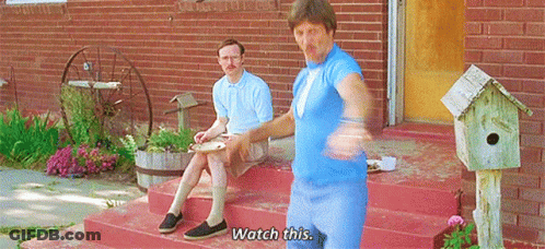 Two Men Sitting On Brick Porch Saying Watch This GIF