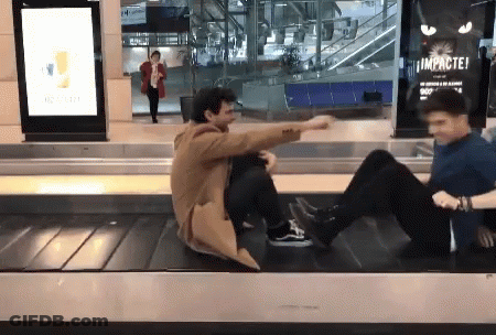 Two Men Sitting On Conveyor Belt Saying Impactei GIF