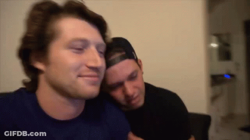 Two Men Sitting On Couch GIF