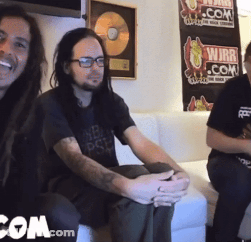 Two Men Sitting On Couch In Front Of WJBR.com Poster GIF