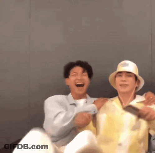 Two Men Sitting On Couch Laughing GIF
