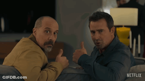 Two Men Sitting On Couch One Thumbs Up GIF