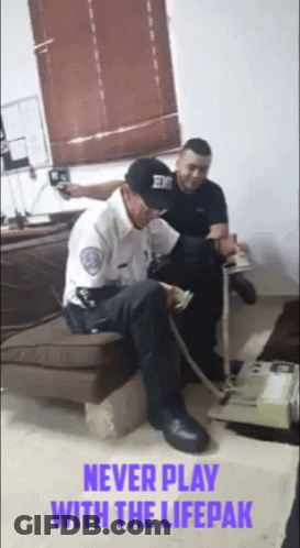 Two Men Sitting On Couch Saying Never Play With Lifepak GIF