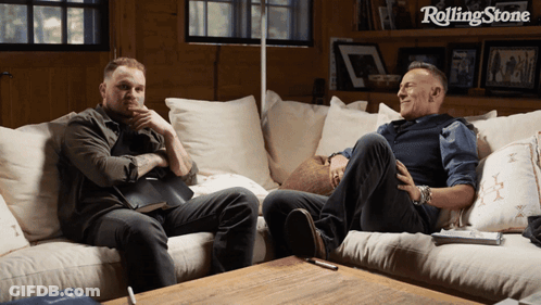 Two Men Sitting On Couch GIF
