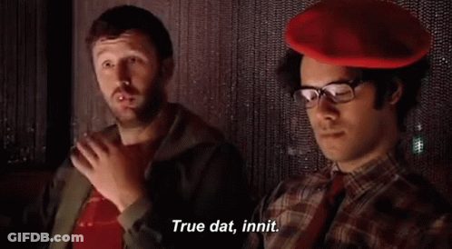 Two Men Sitting, One In Red Hat GIF