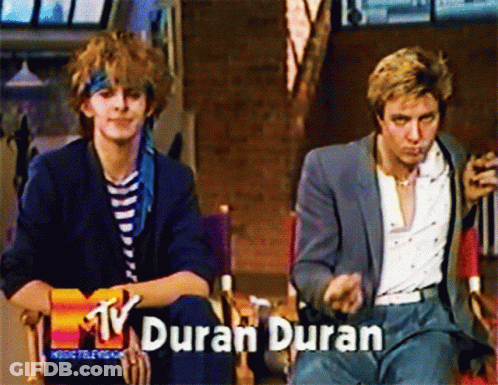 Two Men Sitting Together With Duran Duran GIF