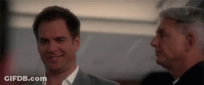 Two Men Smiling Side By Side GIF